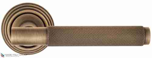 Дверная ручка на круглом основании Fratelli Cattini "UNA X" D8-BY матовая бронза